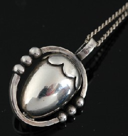 Appraisal: A silver pendant and chain by Georg Jensen The sterling