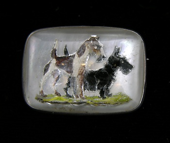 Appraisal: A Reverse Painted Crystal Intagio Pin Depicting Scotties This reverse