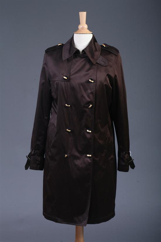 Appraisal: DANA BUCHMAN BROWN SATIN TRENCHCOAT Size medium Knee-length double-breasted button