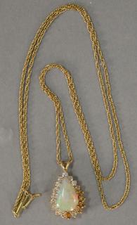 Appraisal: K gold chain and pendant with teardrop opal surrounded by