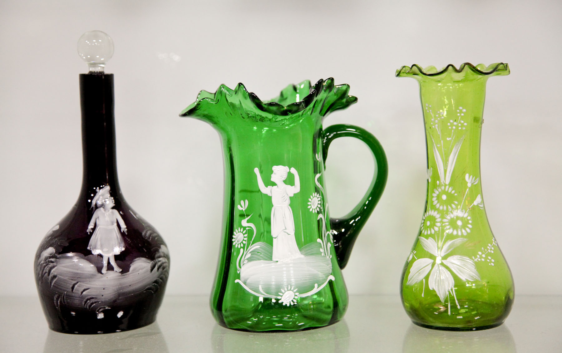 Appraisal: THREE PIECES OF MARY GREGORY GLASS American or Bohemian late