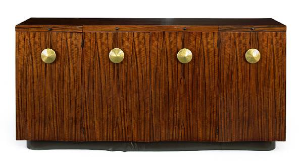 Appraisal: A Gilbert Rohde paldao and brass four door credenza for