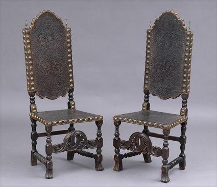 Appraisal: PAIR OF CONTINENTAL BAROQUE-STYLE WALNUT AND STAMPED LEATHER SIDE CHAIRS