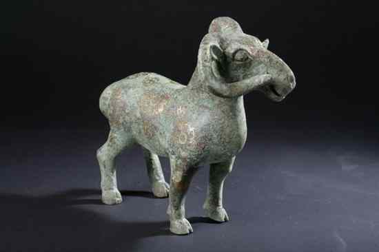 Appraisal: CHINESE ARCHAISTIC BRONZE FIGURE OF A RAM With gilt highlights