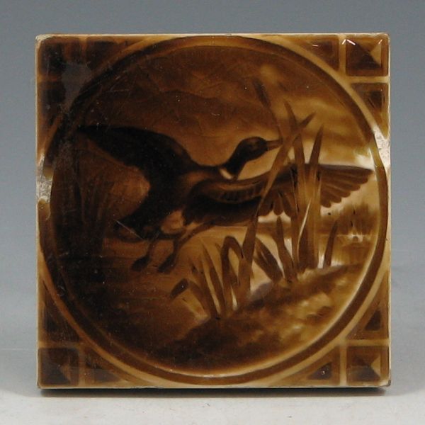 Appraisal: American Encaustic tile of duck in flight Marked AET Co