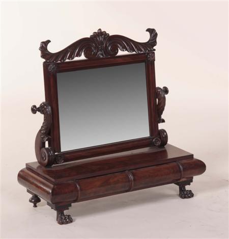 Appraisal: An early th century carved mahogany dressing glass the scroll