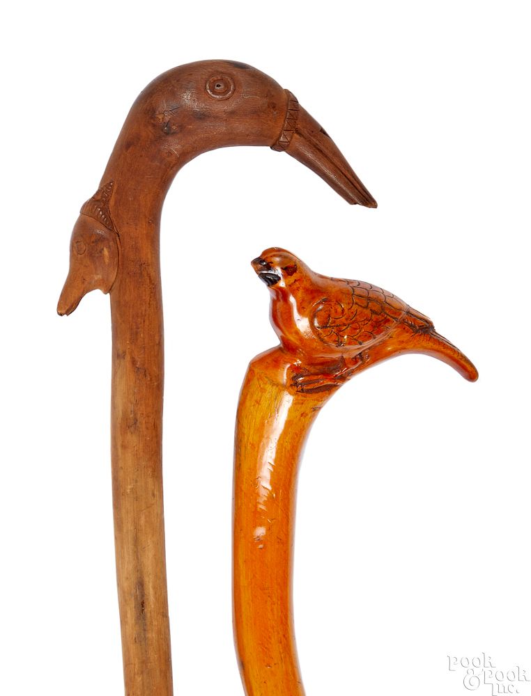 Appraisal: Two carved canes Two carved canes ca with bird and