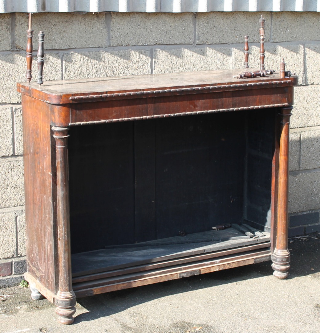 Appraisal: A Regency rosewood bookcase with a double carved moulding raised