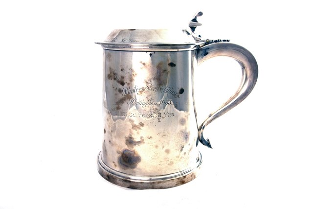 Appraisal: A silver large hinge lidded tankard of tapering cylindrical form