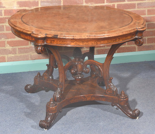 Appraisal: A VICTORIAN FIGURED WALNUT CIRCULAR CENTRE TABLE with banded surround