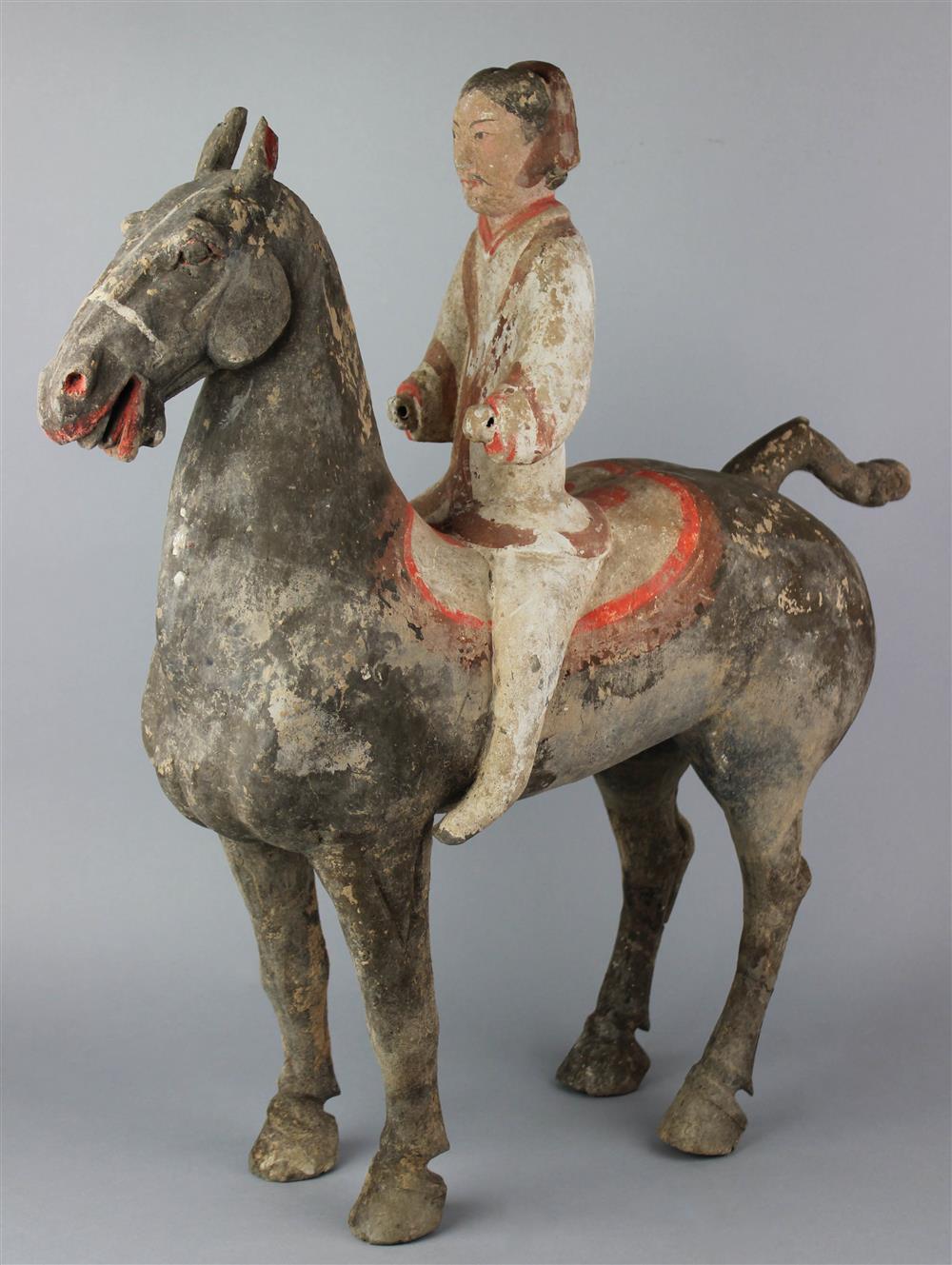 Appraisal: CHINESE LARGE PAINTED POTTERY EQUESTRIAN GROUP HAN DYNASTY the rider