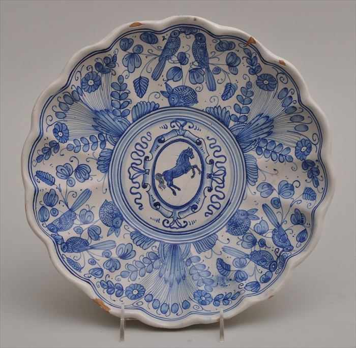 Appraisal: ITALIAN TIN-GLAZED EARTHENWARE BLUE AND WHITE BASIN With waved rim