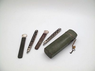 Appraisal: A late th century silver mounted travelling razor set unmarked