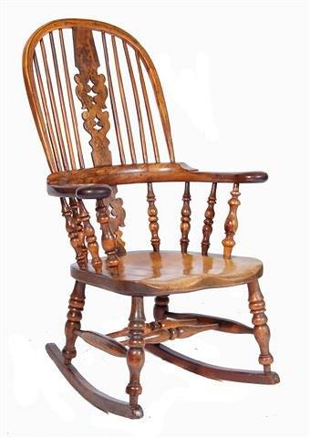 Appraisal: A late th Century yew and elm Windsor rocking chair