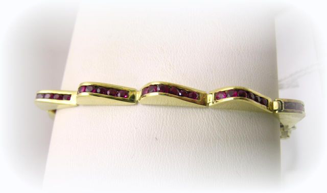 Appraisal: Lagos K Yellow Gold Link Bracelet with Chanel-Set Round Rubies