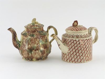 Appraisal: Two creamware teapots and covers one decorated with a mottled