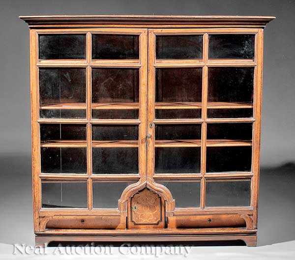 Appraisal: A Swiss Carved Wood Display Cabinet th c molded frieze