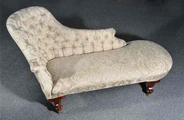 Appraisal: A VICTORIAN STYLE BUTTON BACK CHAISE LONGUE of shaped form