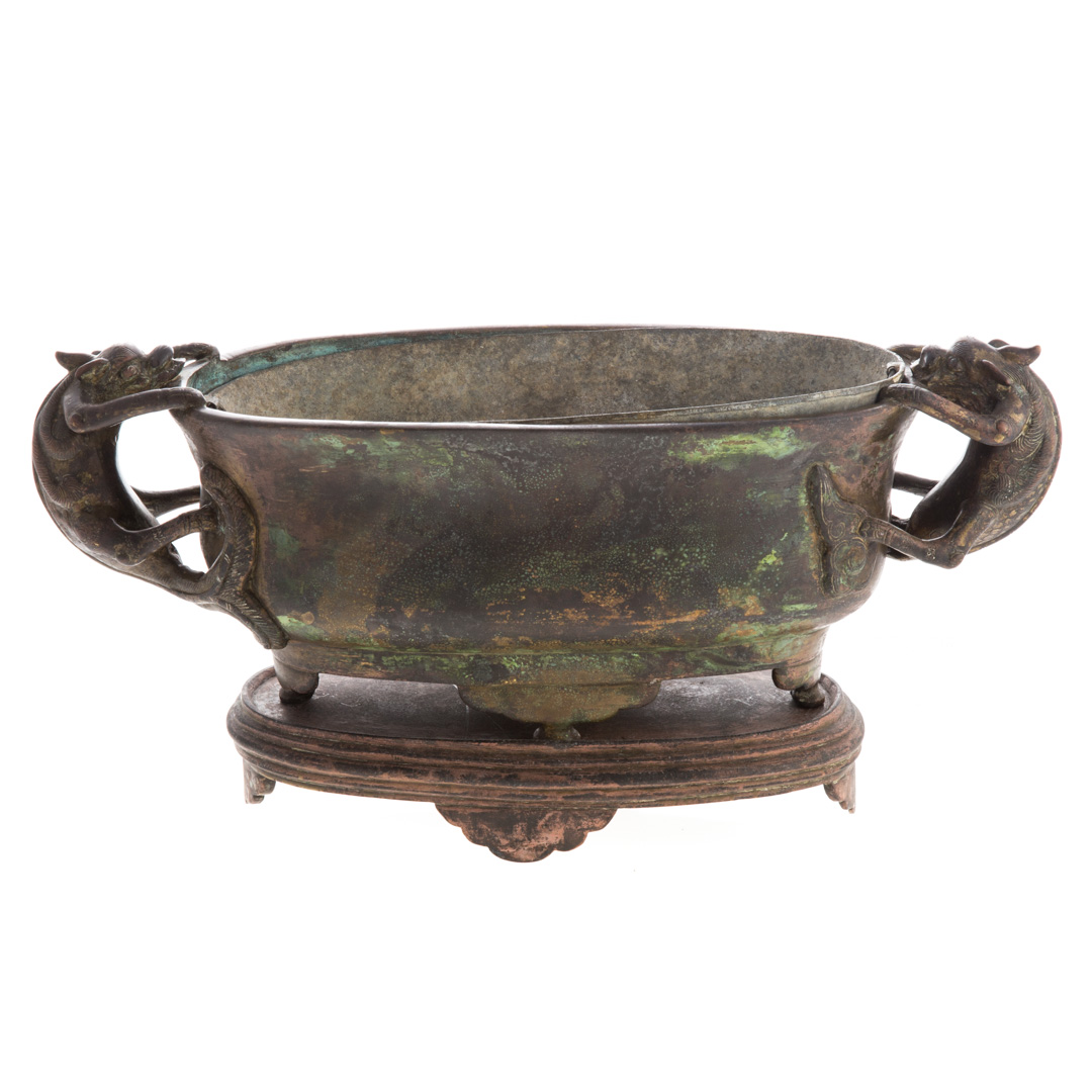 Appraisal: Chinese bronze double-handled vessel dragon-form handles with impressed character mark