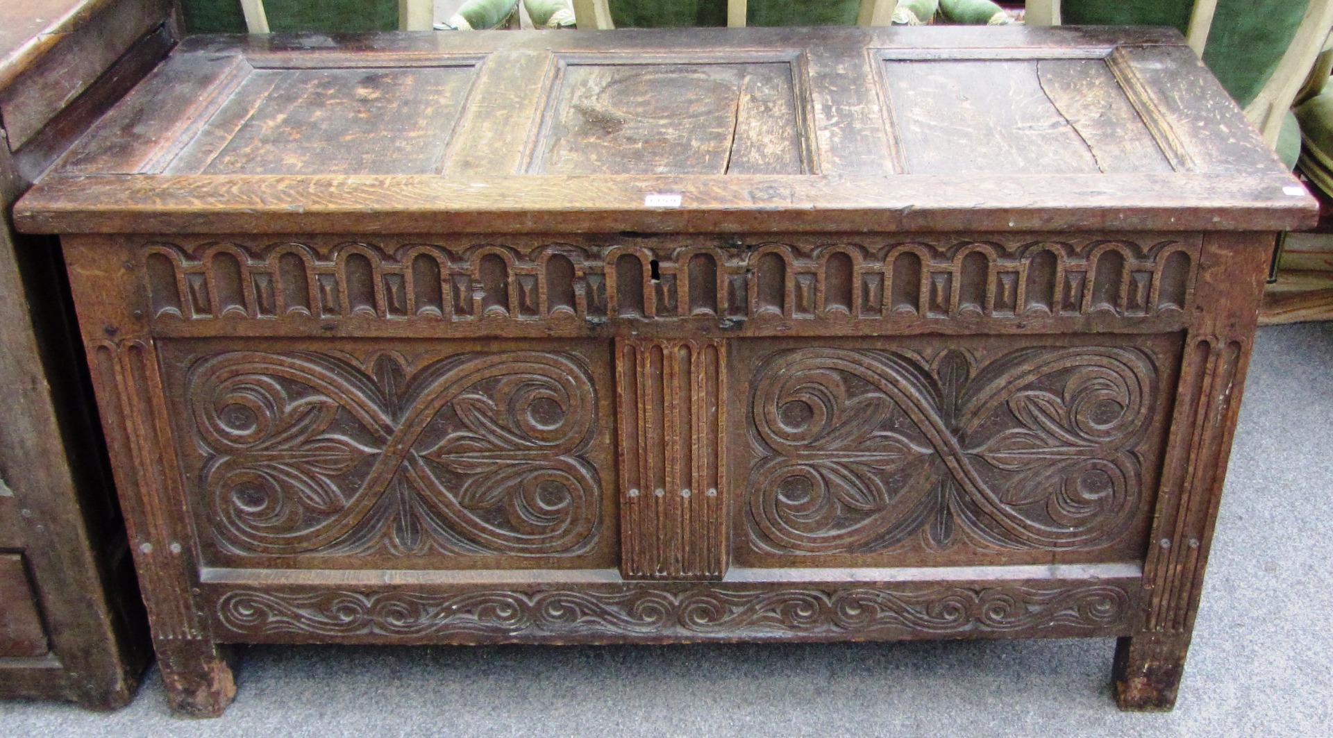 Appraisal: An th century oak coffer with triple panel top over