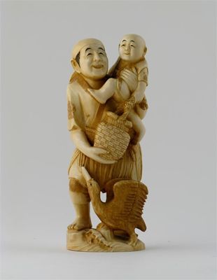 Appraisal: A Japanese ivory carving of a father and child the