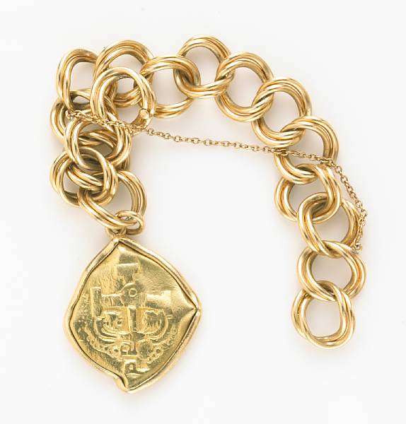 Appraisal: A k gold link bracelet suspending an ancient motif charm