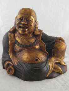 Appraisal: A sitting wooden Buddha gilded and painted cm across x