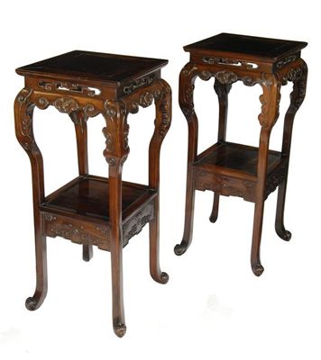 Appraisal: A pair of Chinese carved padouk jardiniere stands each with