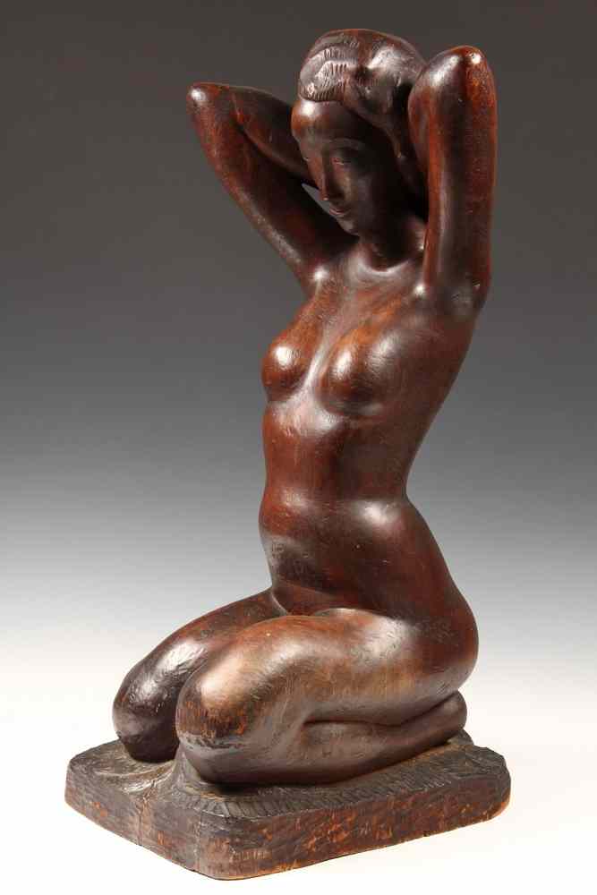 Appraisal: WOODEN SCULPTURE - Carved Mahogany Sculpture of a Kneeling Long-Haired