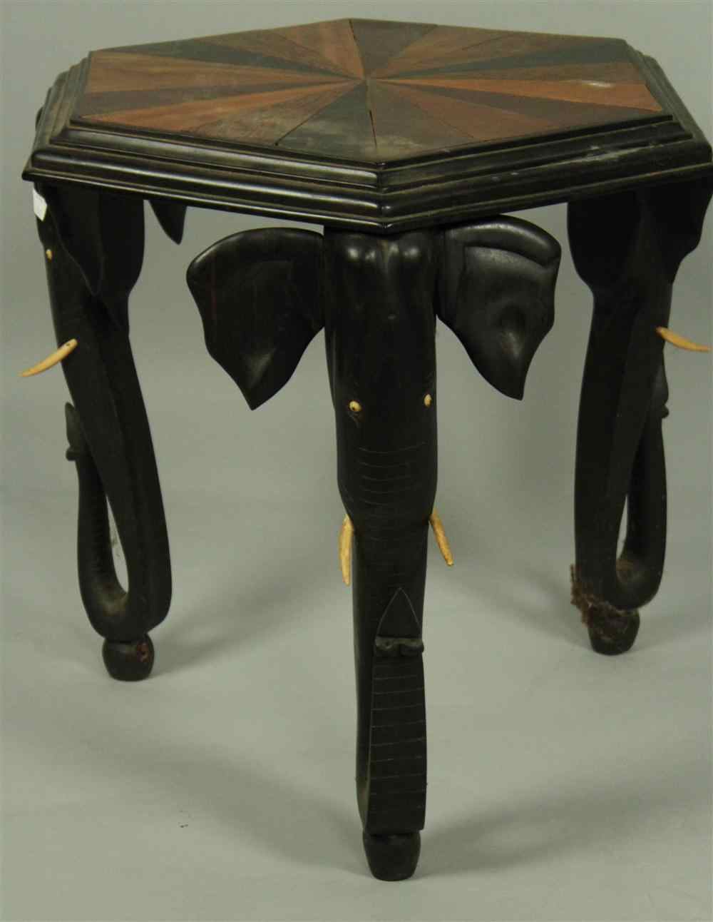 Appraisal: AFRICAN EBONIZED HEXAGONAL SIDE TABLE having a marquetry rayed top