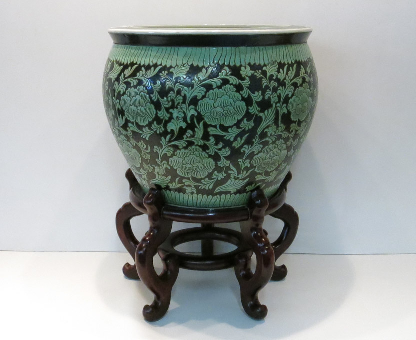 Appraisal: CHINESE PORCELAIN JARDINIERE AND WOOD STAND The jardiniere having green