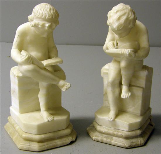 Appraisal: Pair of th century white marble bookends of two young