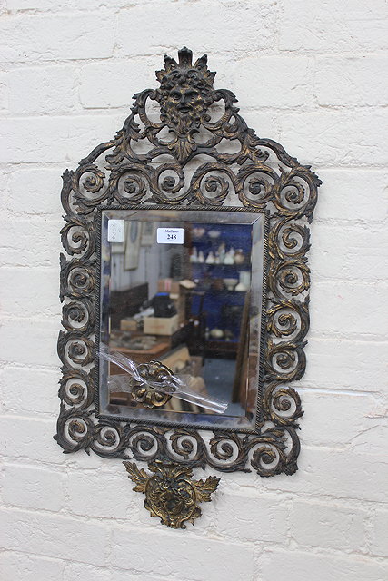 Appraisal: A TH CENTURY BRASS HANGING WALL MIRROR with bevelled glass