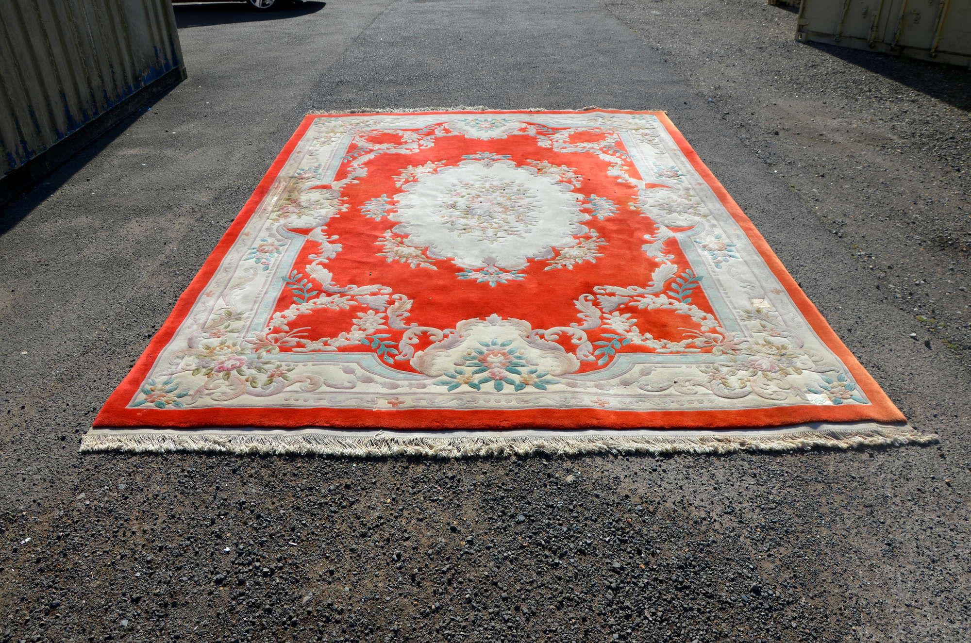 Appraisal: A large red ground Chinese style carpet cm x cm