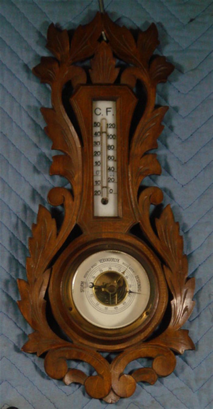 Appraisal: Carved walnut Black Forest barometer h Estimate -