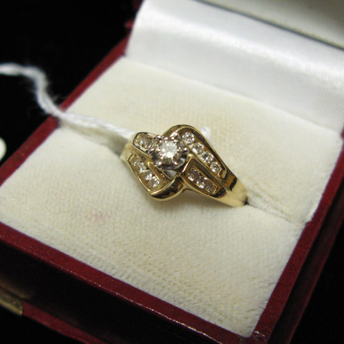 Appraisal: DIAMOND AND FOURTEEN KARAT GOLD RING centering a round prong-set