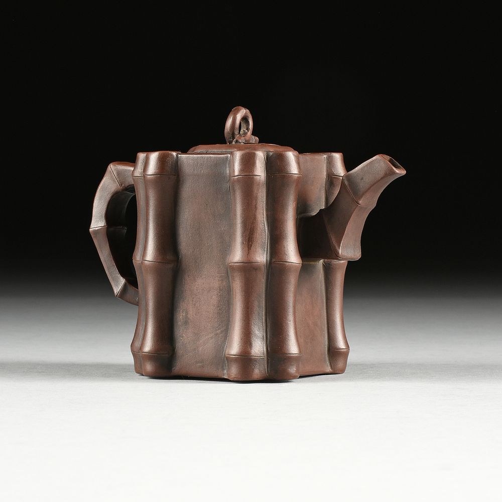 Appraisal: A YIXING ZHU SHA CLAY BAMBOO CLUSTER TEAPOT LATE QING