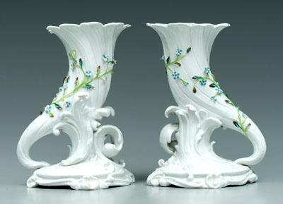 Appraisal: Pair porcelain cornucopia vases encrusted with flowers blue printed conjoined