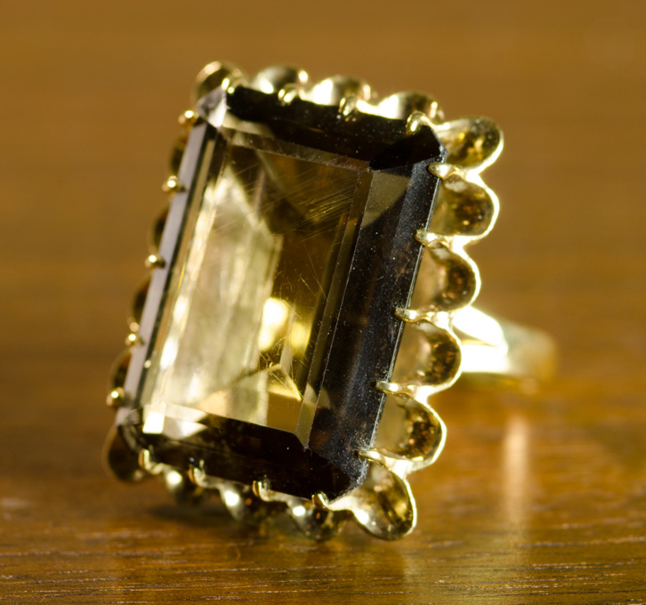 Appraisal: SMOKY QUARTZ AND FOURTEEN KARAT GOLD RING set with a