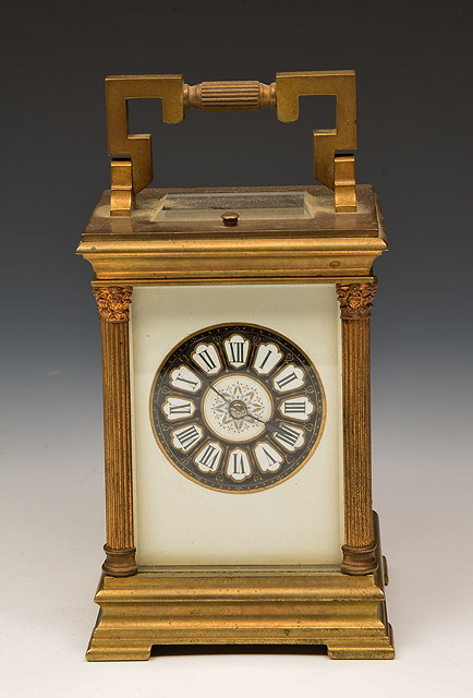 Appraisal: A FRENCH BRASS CARRIAGE CLOCK stamped E M Co with