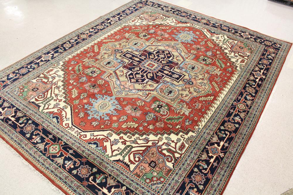 Appraisal: HAND KNOTTED ORIENTAL CARPET Persian Serapi or Heriz design centering