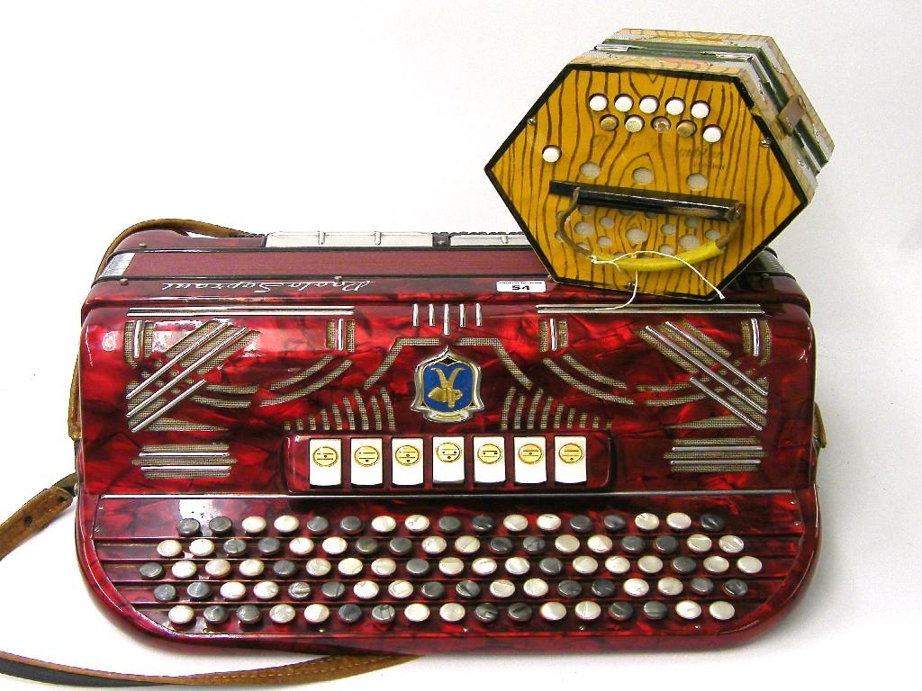 Appraisal: Paola Soprani accordion red finish case together with Rosetti Rambler