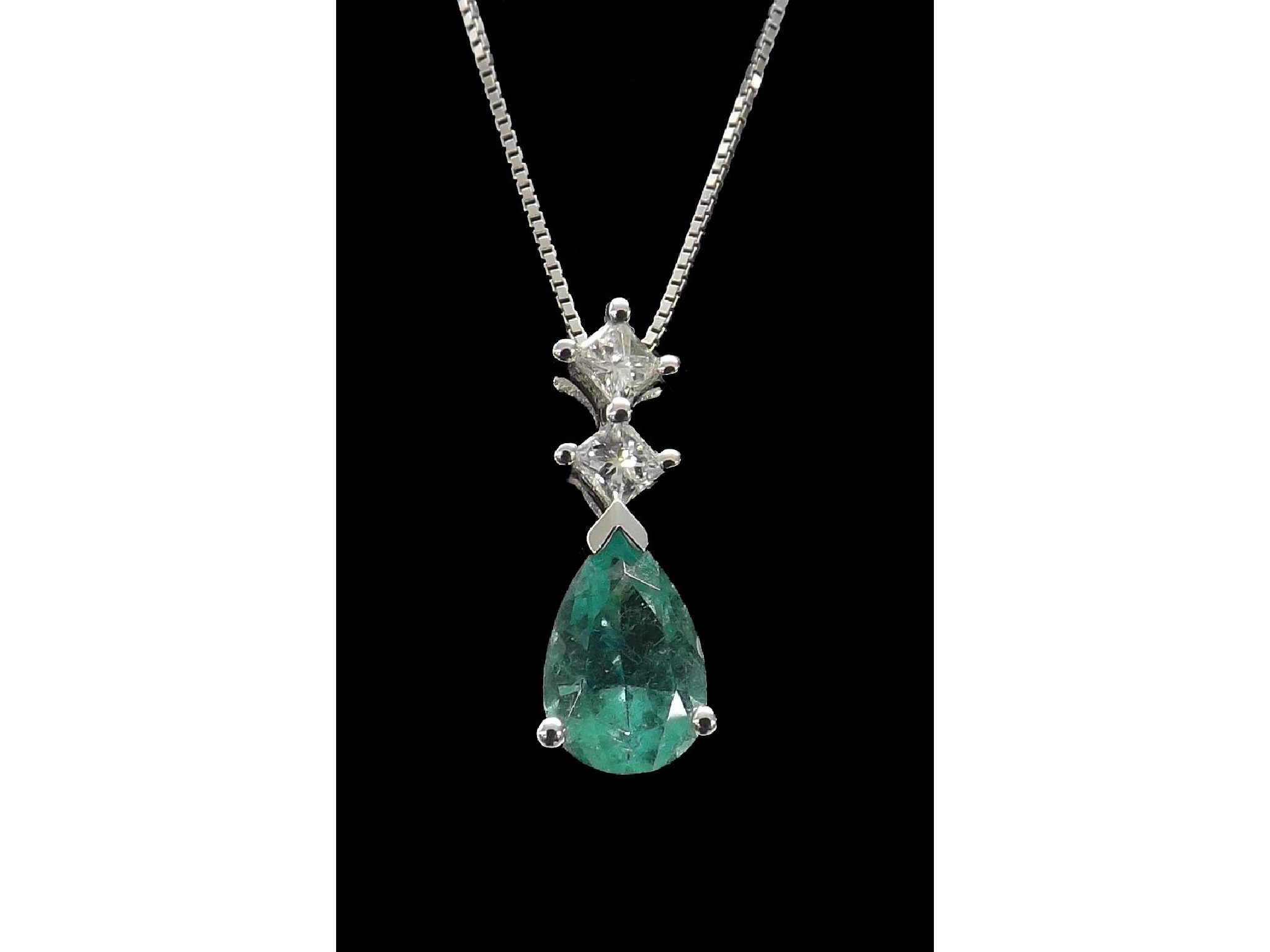 Appraisal: ct white gold emerald and diamond pendant on a slender