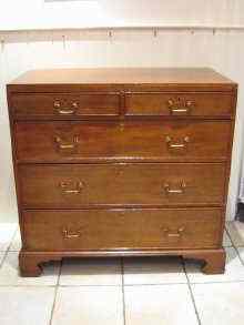 Appraisal: A th c oak chest of drawers on bracket feet