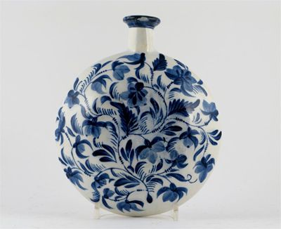 Appraisal: A pearlware flask each side painted in blue with swirling