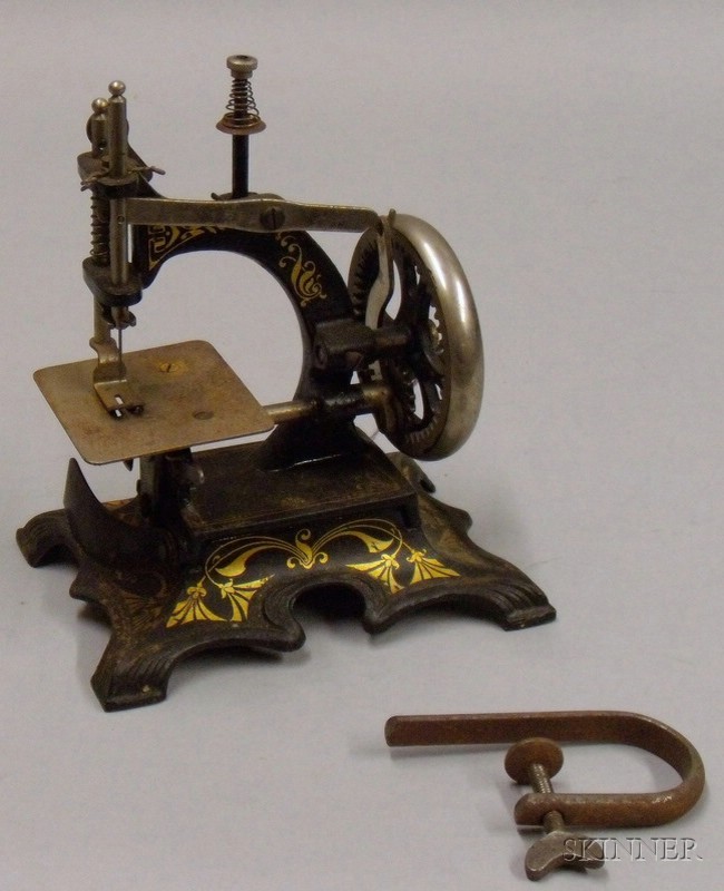 Appraisal: Painted Cast Iron Toy Sewing Machine Germany early th century