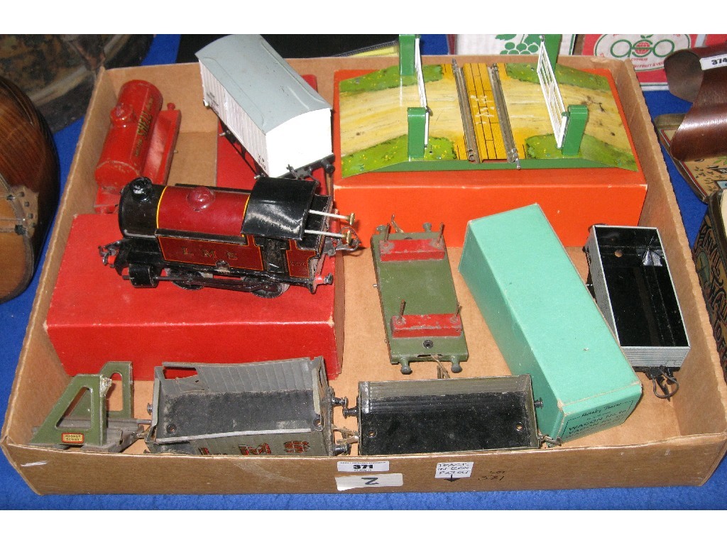 Appraisal: Lot comprising Hornby O Gauge Tinplate train engine trucks tanker