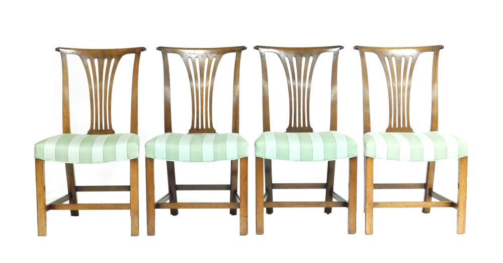 Appraisal: Four Chippendale style side dining chairs with scrolled ears pierced