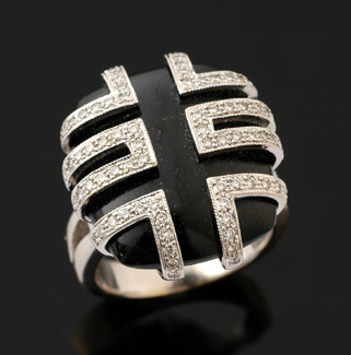 Appraisal: An onyx and diamond plaque ring The cushion shaped onyx