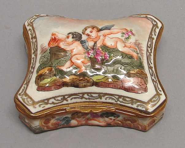 Appraisal: Pillow form with concave sides putti in landscape one tending